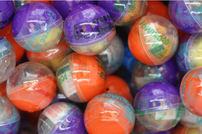 A pile of colorful balls with different designs.