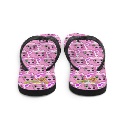 A pair of flip flops with pink and black design.