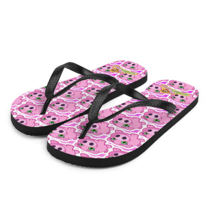 A pair of pink flip flops with a picture of a dog.