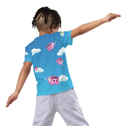 A child wearing a blue shirt with clouds and owls on it.