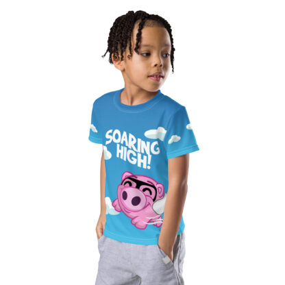 A kid wearing a blue shirt with a pink bear on it.