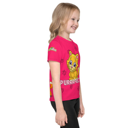 A girl wearing a pink shirt with a yellow dog on it.