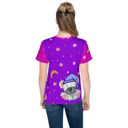 A girl wearing a purple shirt with stars and moon.