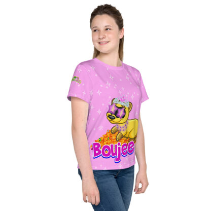 A girl wearing a pink shirt with a dog on it.