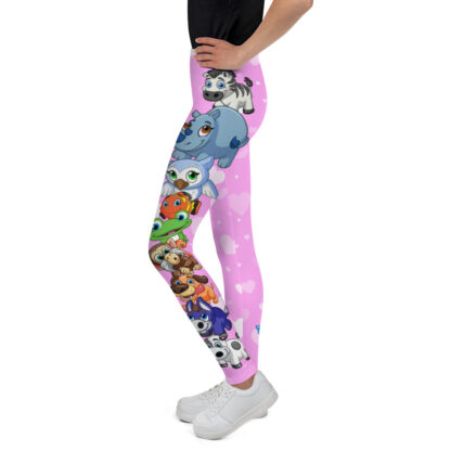 A girl wearing pink leggings with different animals on it.
