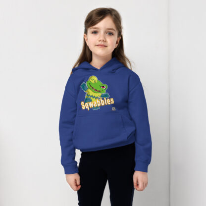 A little girl wearing a blue hoodie with squibbles on it.