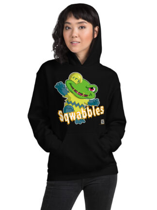 A woman wearing a black hoodie with a cartoon of a green alligator.