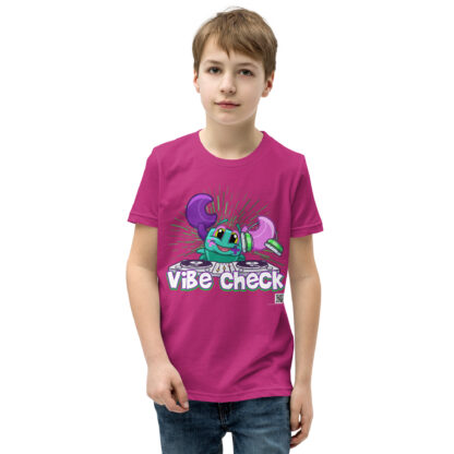 A kid wearing a pink shirt with the words " vibe chick ".