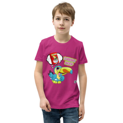 A kid wearing a pink shirt with a cartoon of a bird