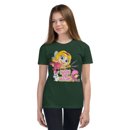 A girl wearing a green shirt with a cartoon of a girl and her cat.