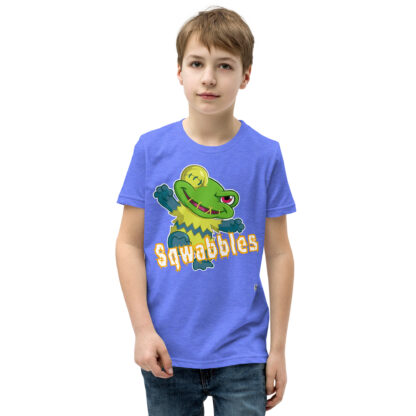 A kid wearing a blue t-shirt with the word squabbles on it.