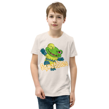 A kid wearing a t-shirt with an alligator on it.