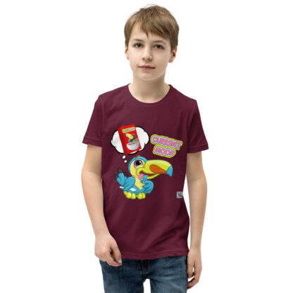 A kid wearing a maroon t-shirt with different designs on it.