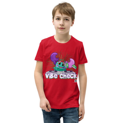 A kid wearing a red shirt with the words " vibe chick ".