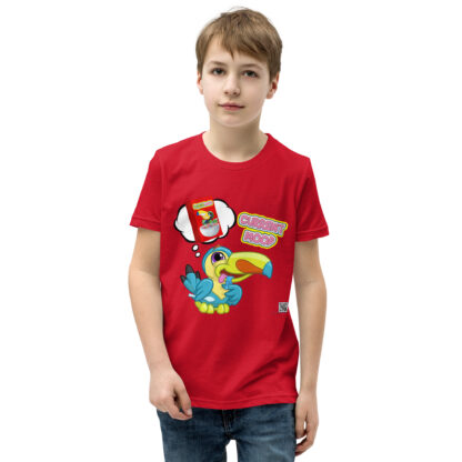 A kid wearing a red shirt with a bird on it